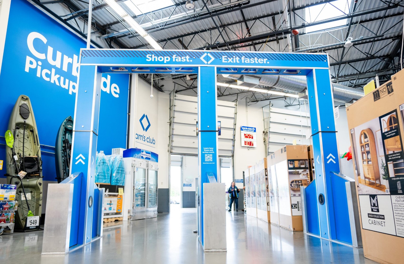 Blue archway exits with camera, computer vision and AI tech built in to facilitate automated exit from store.