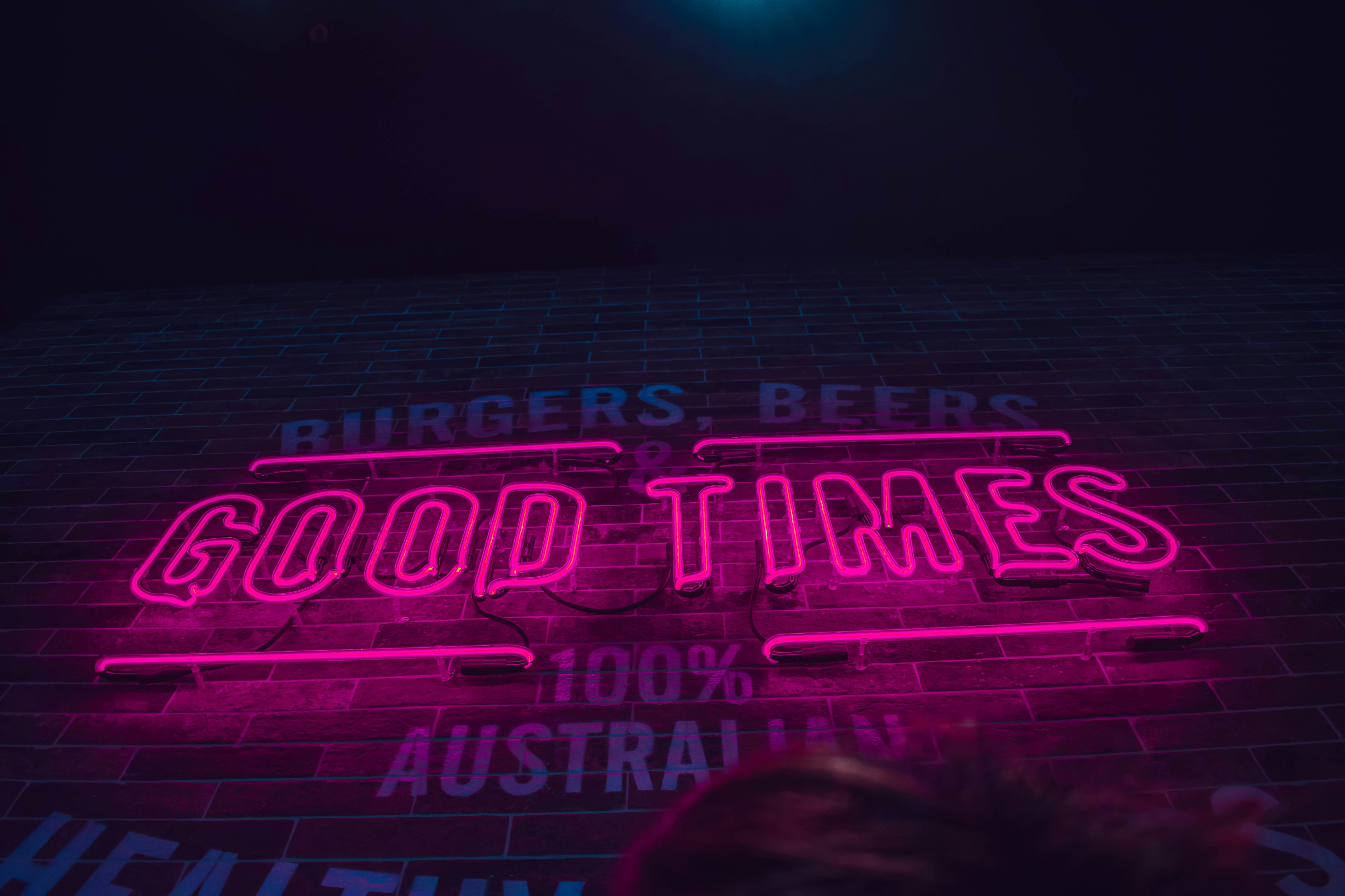 Pink neon sign: Good Times.