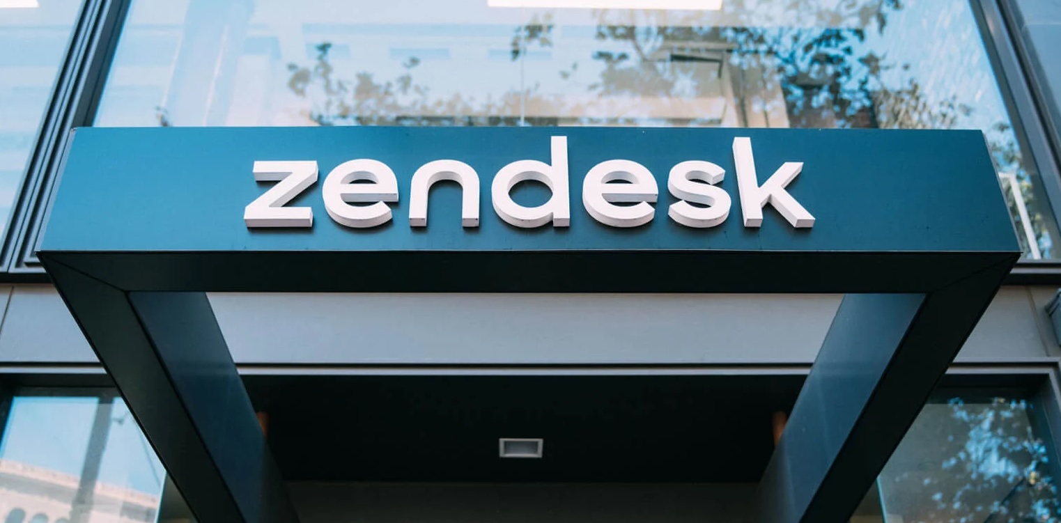 Zendesk logo over a doorway in an office building.