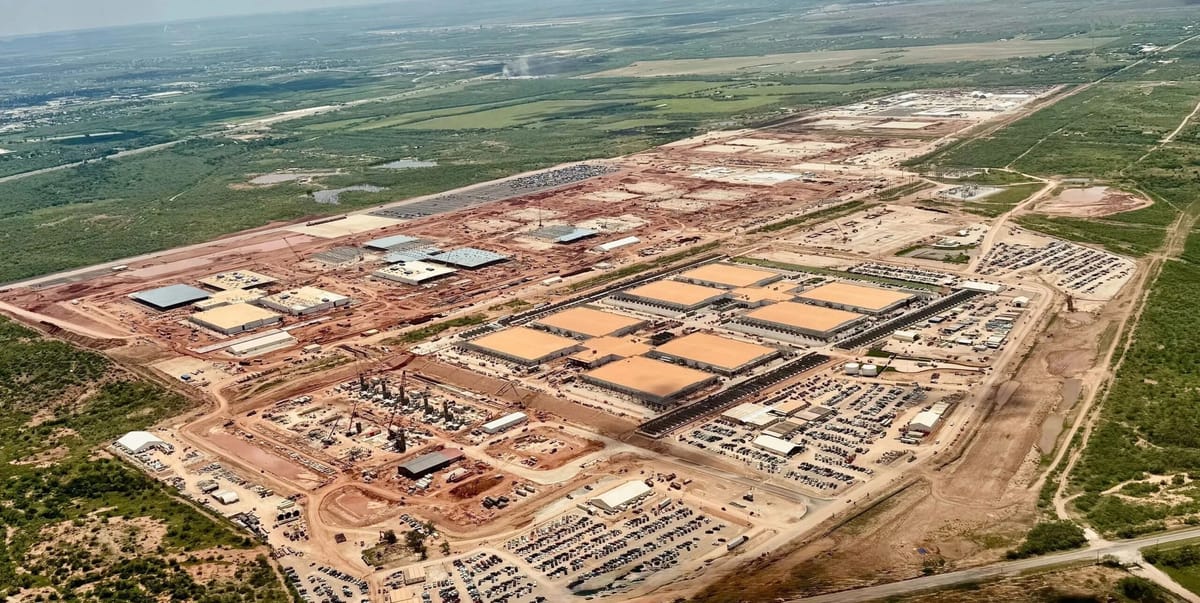 Aerial view of Crusoe Energy’s large-scale data center complex under construction in Abilene, Texas, showing multiple tan-roo