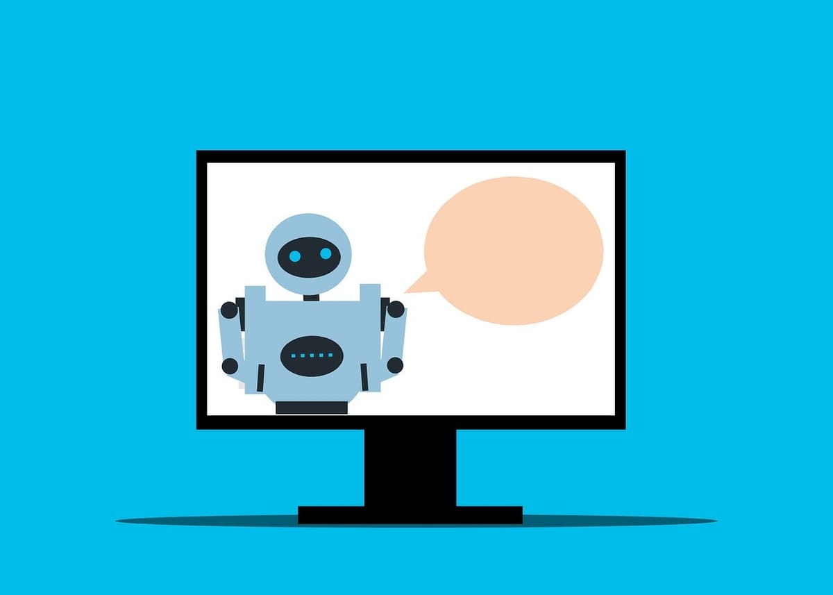 Illustration of a robot on a computer monitor screen with a blank speech bubble, set against a bright blue background.