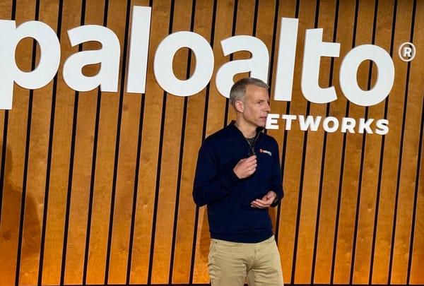 Palo Alto Networks chief product officer Lee Klarich speaking on stage with a paloalto networks logo behind him.