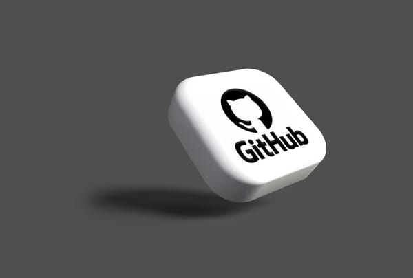 GitHub logo and mascot on tile leaning on a grey background.